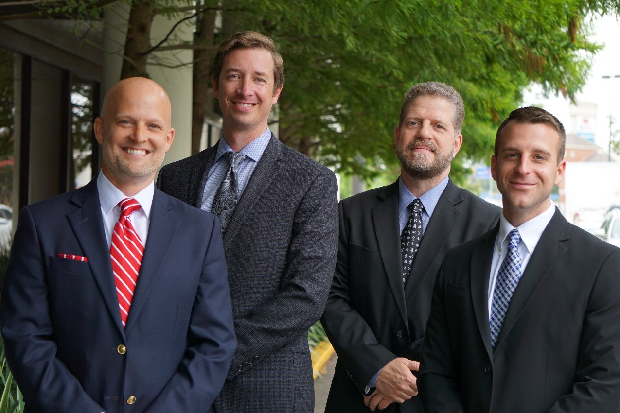 Group photo of four Evangeline Bank and Trust Vice Presidents